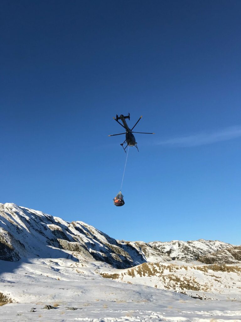 Helicopter carrying supplies